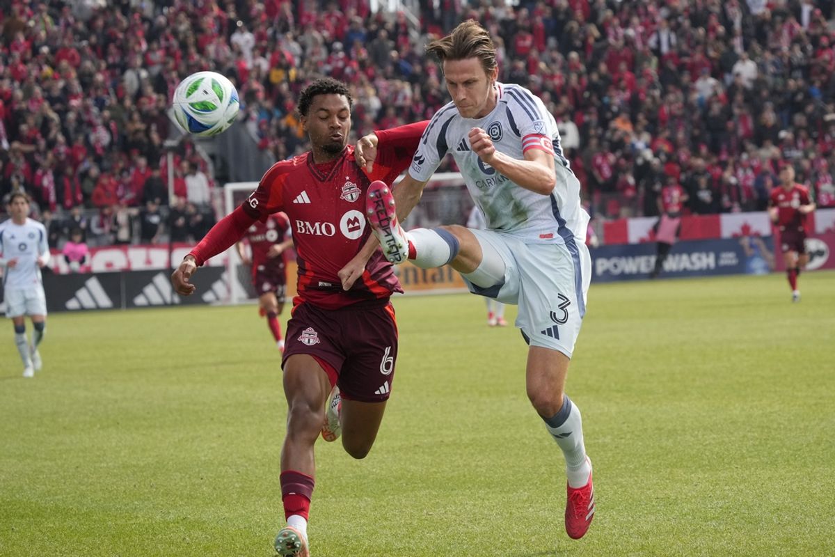 Mar 15, 2025; Toronto, Ontario, CAN; Chicago Fire defender Jack Elliott (3) kicks the ball away from Toronto FC midfielder Kosi Thompson (6) during the first half at BMO Field. Mandatory Credit: John E. Sokolowski-Imagn Images