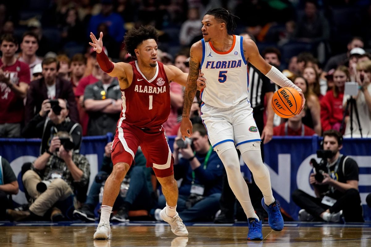 Alabama guard Mark Sears (1) guards Florida guard Will Richard (5) during the first half of a Southeastern Conference tournament semifinal game at Bridgestone Arena in Nashville, Tenn., Saturday, March 15, 2025.