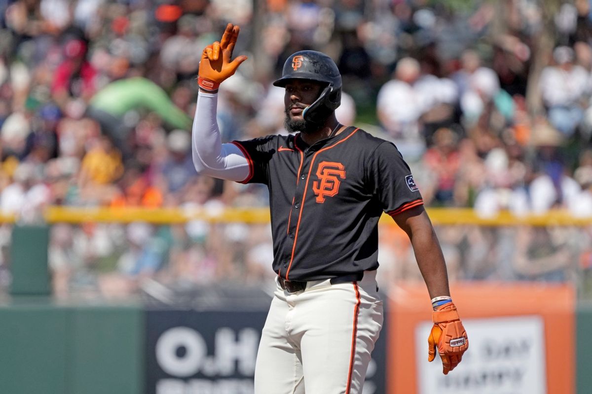 Mar 15, 2025; Scottsdale, Arizona, USA; San Francisco Giants outfielder Jerar Encarnacion (59) reacts after hitting a double against the Seattle Mariners in the second inning at Scottsdale Stadium. Mandatory Credit: Rick Scuteri-Imagn Images