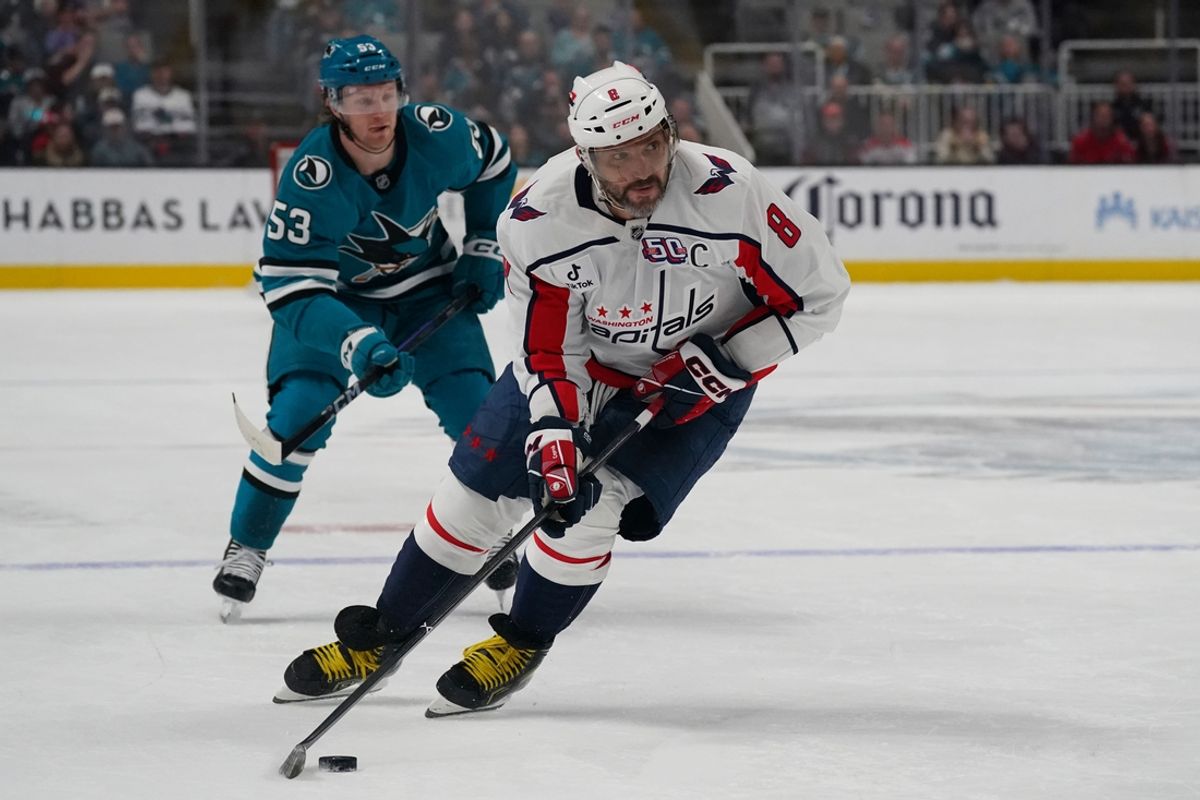 Mar 15, 2025; San Jose, California, USA;  Washington Capitals left wing Alex Ovechkin (8) skates past San Jose Sharks center Ty Dellandrea (53) during the first period at SAP Center at San Jose. Mandatory Credit: David Gonzales-Imagn Images