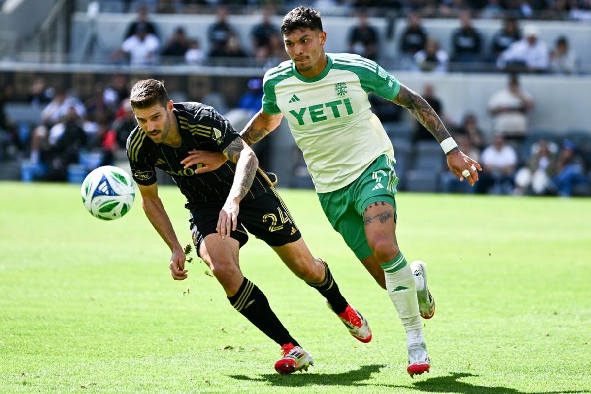 Mar 15, 2025; Los Angeles, California, USA; Austin FC forward Brandon Vázquez (9) and Los Angeles FC defender Ryan Hollingshead (24) battle for the ball during the second half at BMO Stadium. Mandatory Credit: Kelvin Kuo-Imagn Images