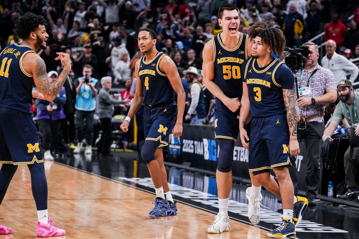 The Michigan Wolverines celebrate after Michigan Wolverines guard Tre Donaldson (3) scored the game-winning layup Saturday, March 15, 2025, in a semifinals game at the 2025 TIAA Big Ten Men’s Basketball Tournament between the Michigan Wolverines and the Maryland Terrapins at Gainbridge Fieldhouse in Indianapolis. The Michigan Wolverines defeated the Maryland Terrapins, 81-80.