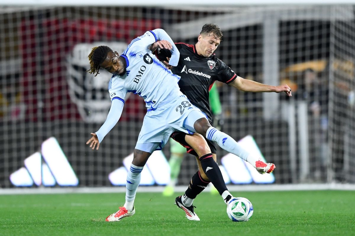 Mar 15, 2025; Washington, District of Columbia, USA; CF Montreal forward Jules-Anthony Vilsaint (28) and D.C. United defender Lucas Bartlett (3) battle for the ball during the first half at Audi Field. Mandatory Credit: Hannah Foslien-Imagn Images