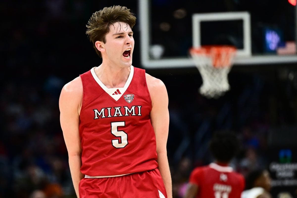 Mar 15, 2025; Cleveland, OH, USA;  Miami (Oh) Redhawks guard Peter Suder (5) celebrates after hitting a three point basket against the Akron Zips during the first half of the MAC Conference Tournament Championship game at Rocket Arena. Mandatory Credit: Ken Blaze-Imagn Images