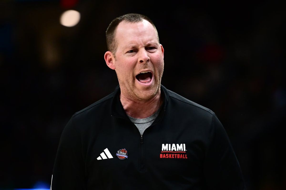 Mar 15, 2025; Cleveland, OH, USA;  Miami (Oh) Redhawks head coach Travis Steele reacts against the Akron Zips during the first half of the MAC Conference Tournament Championship game at Rocket Arena. Mandatory Credit: Ken Blaze-Imagn Images