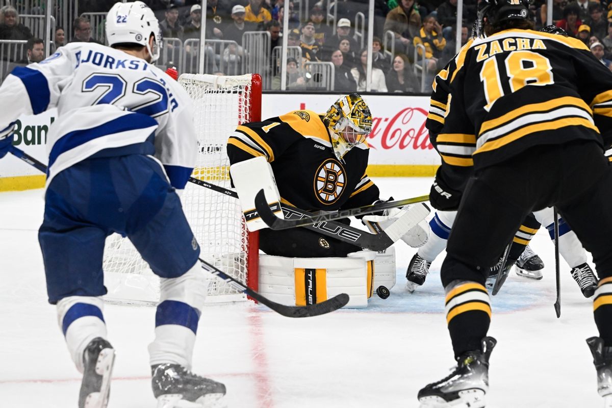 Mar 15, 2025; Boston, Massachusetts, USA; Boston Bruins goaltender Jeremy Swayman (1) makes a save against Tampa Bay Lightning right wing Oliver Bjorkstrand (22) during the second period at TD Garden. Mandatory Credit: Eric Canha-Imagn Images