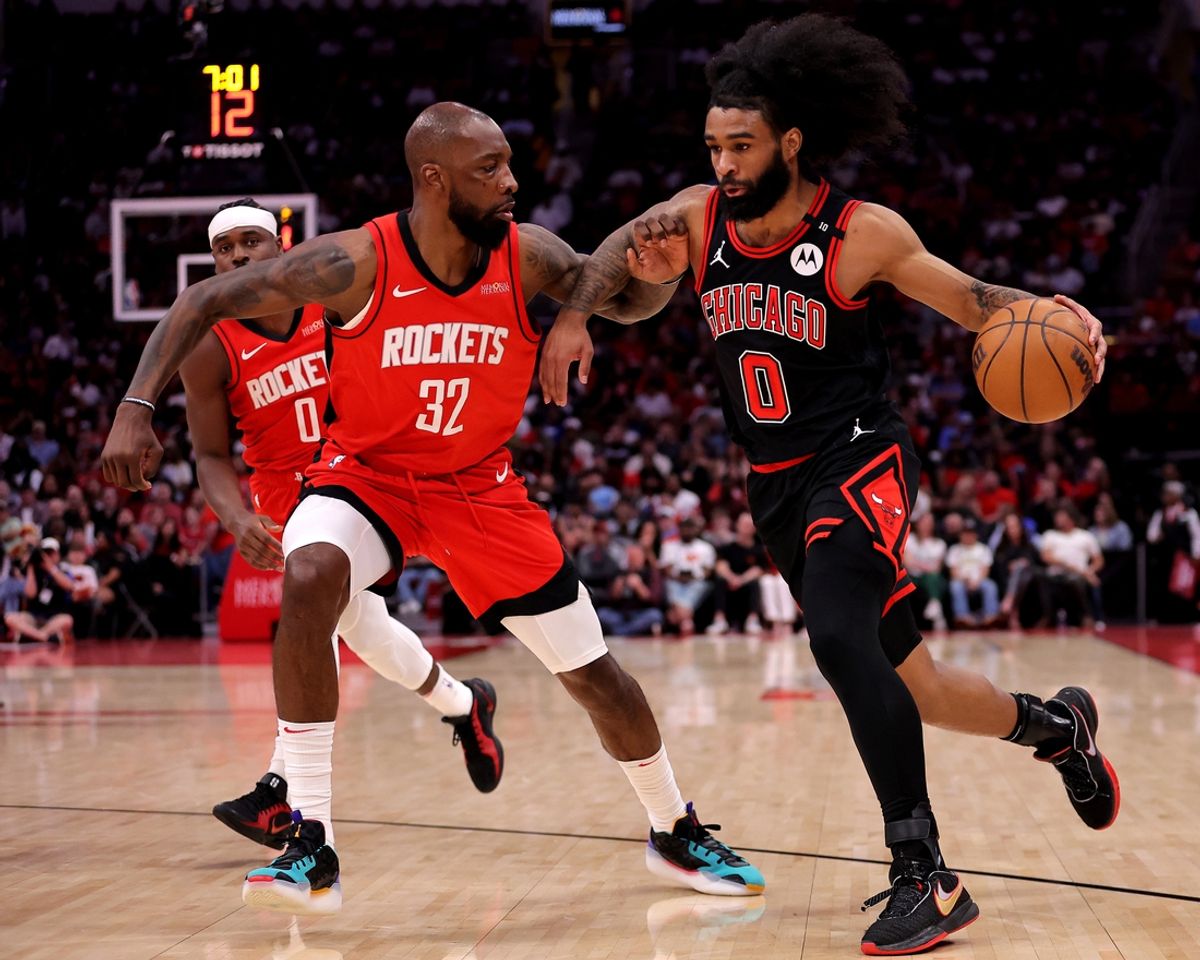 Mar 15, 2025; Houston, Texas, USA; Chicago Bulls guard Coby White (0) handles the ball against Houston Rockets forward Jeff Green (32) during the second quarter at Toyota Center. Mandatory Credit: Erik Williams-Imagn Images