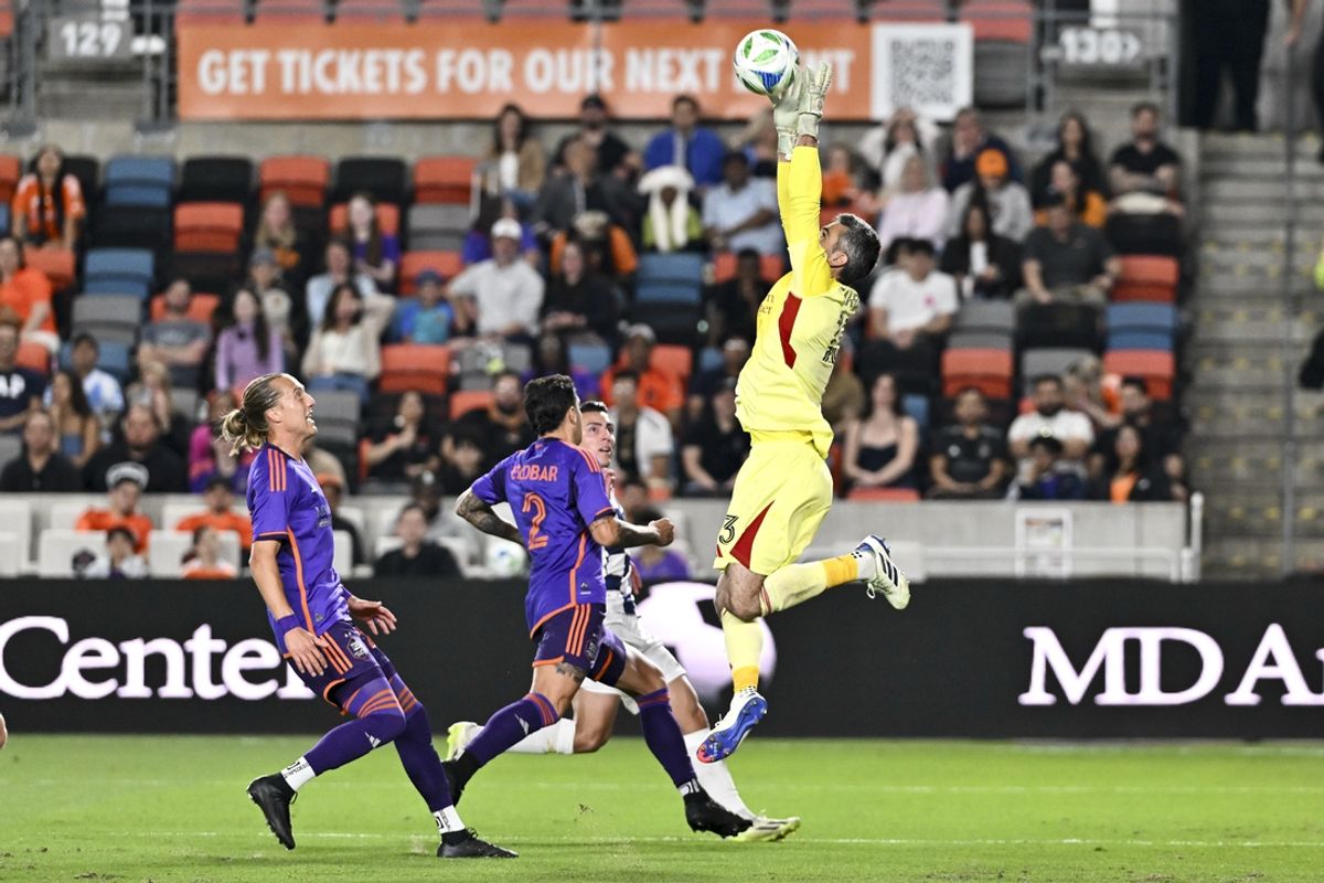 Mar 15, 2025; Houston, Texas, USA; Houston Dynamo goalkeeper Andrew Tarbell (13) makes a save during the first half against the Real Salt Lake at Shell Energy Stadium. Mandatory Credit: Maria Lysaker-Imagn Images