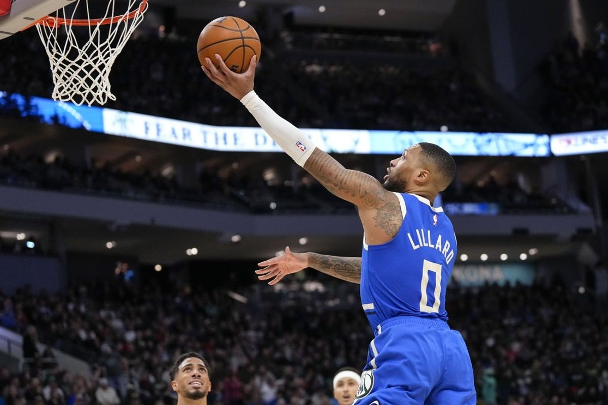 Mar 15, 2025; Milwaukee, Wisconsin, USA; Milwaukee Bucks guard Damian Lillard (0) shoots during the third quarter against the Indiana Pacers at Fiserv Forum. Mandatory Credit: Jeff Hanisch-Imagn Images