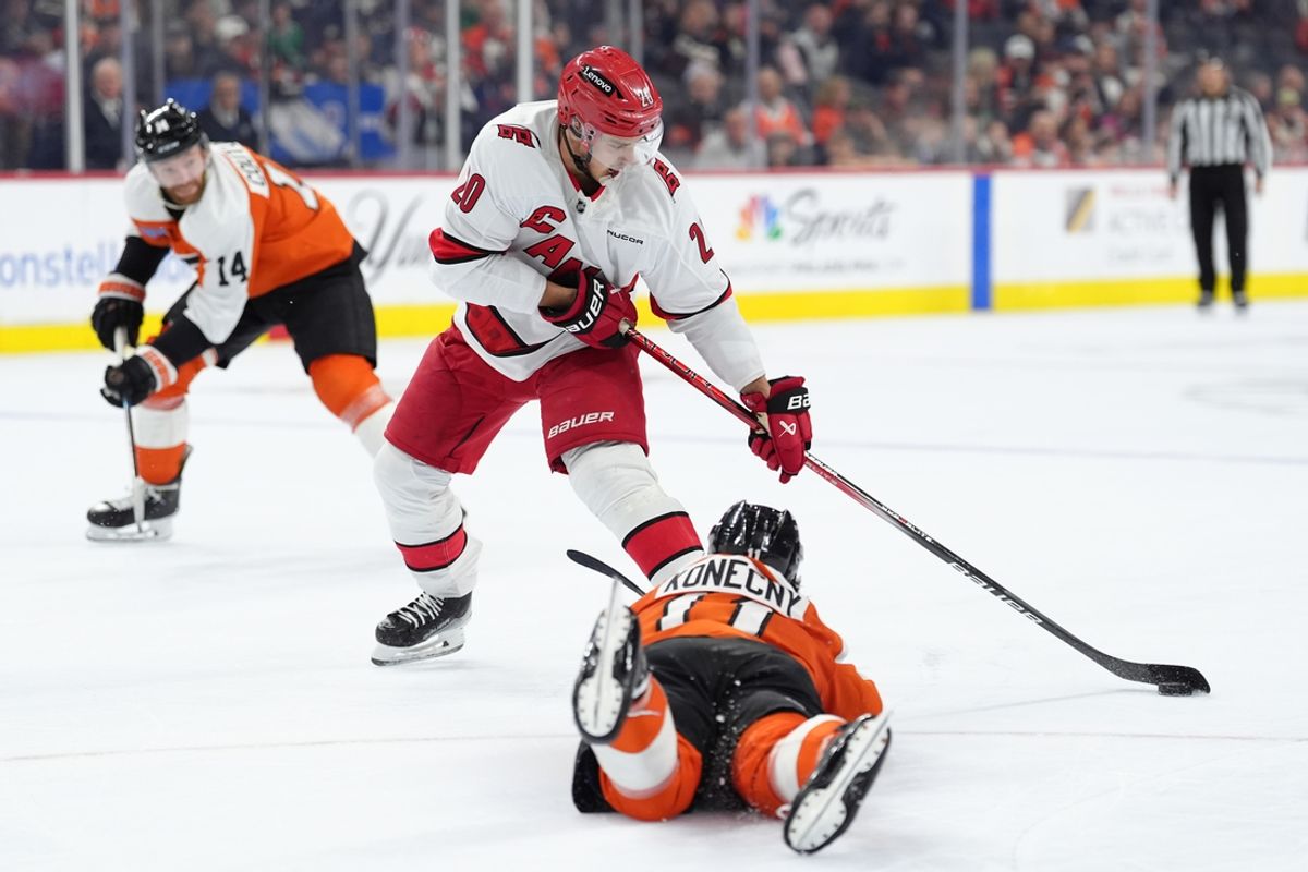 Mar 15, 2025; Philadelphia, Pennsylvania, USA; Carolina Hurricanes center Sebastian Aho (20) avoids Philadelphia Flyers right wing Travis Konecny (11) in the third period at Wells Fargo Center. Mandatory Credit: Kyle Ross-Imagn Images