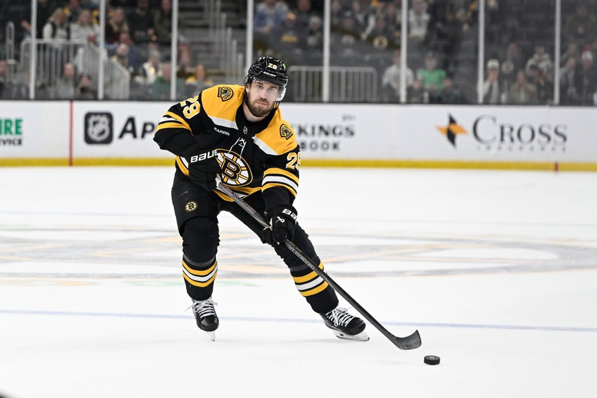 Mar 15, 2025; Boston, Massachusetts, USA; Boston Bruins defenseman Parker Wotherspoon (29) passes the puck during the third period against the Tampa Bay Lightning at TD Garden. Mandatory Credit: Eric Canha-Imagn Images