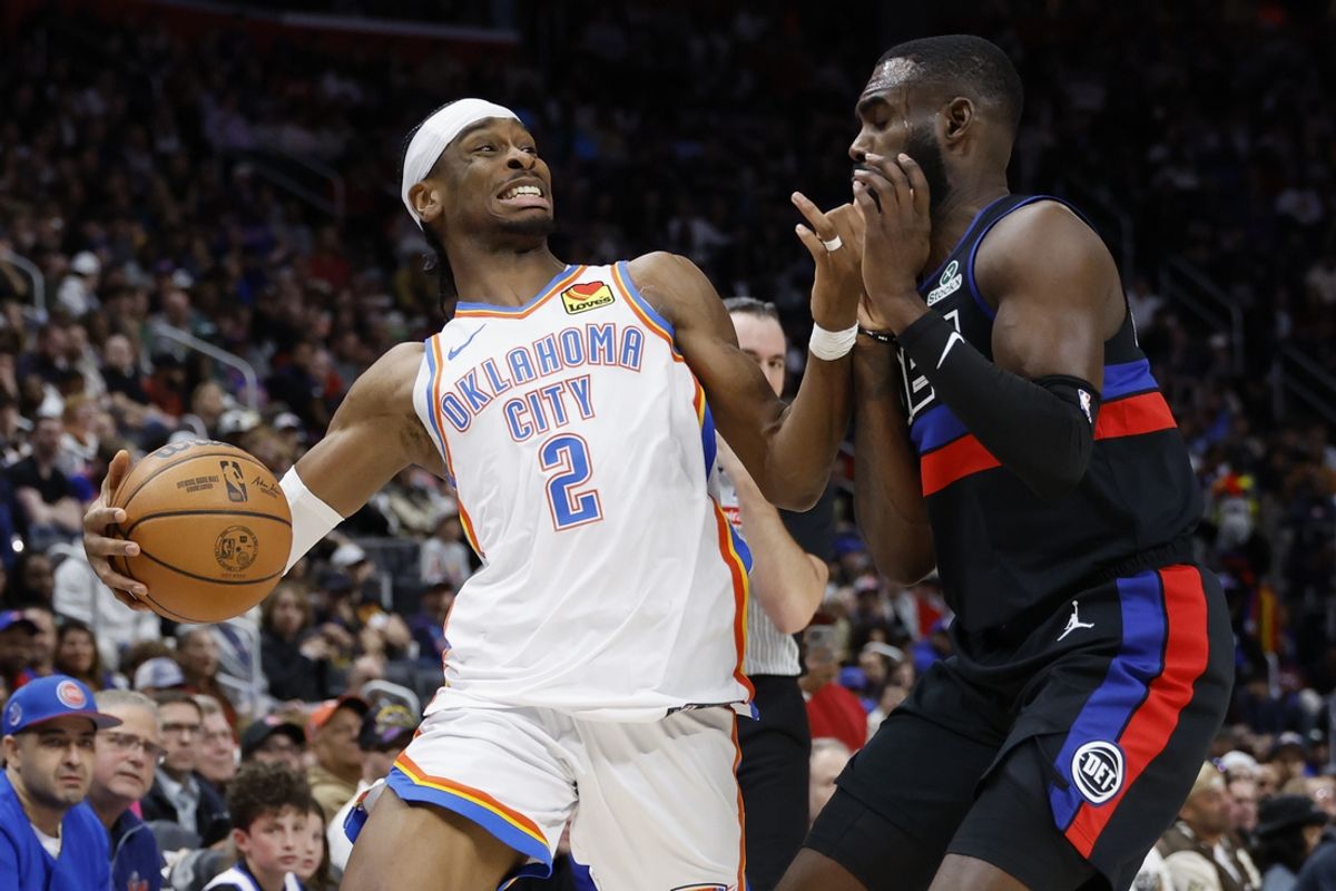 Mar 15, 2025; Detroit, Michigan, USA; Oklahoma City Thunder guard Shai Gilgeous-Alexander (2) is defended by Detroit Pistons forward Tim Hardaway Jr. (8) in the second half at Little Caesars Arena. Mandatory Credit: Rick Osentoski-Imagn Images