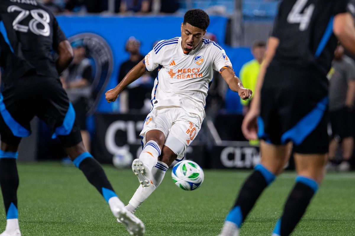 Mar 15, 2025; Charlotte, North Carolina, USA; FC Cincinnati midfielder Evander (10) shoots against the Charlotte FC during the second half at Bank of America Stadium. Mandatory Credit: Scott Kinser-Imagn Images