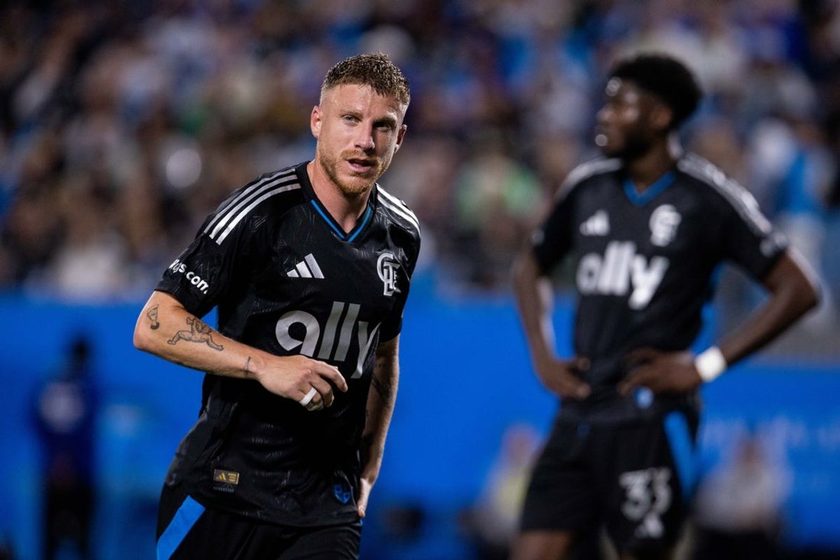 Mar 15, 2025; Charlotte, North Carolina, USA; Charlotte FC midfielder Pep Biel (16) heads for a corner kick against the FC Cincinnati during the first half at Bank of America Stadium. Mandatory Credit: Scott Kinser-Imagn Images