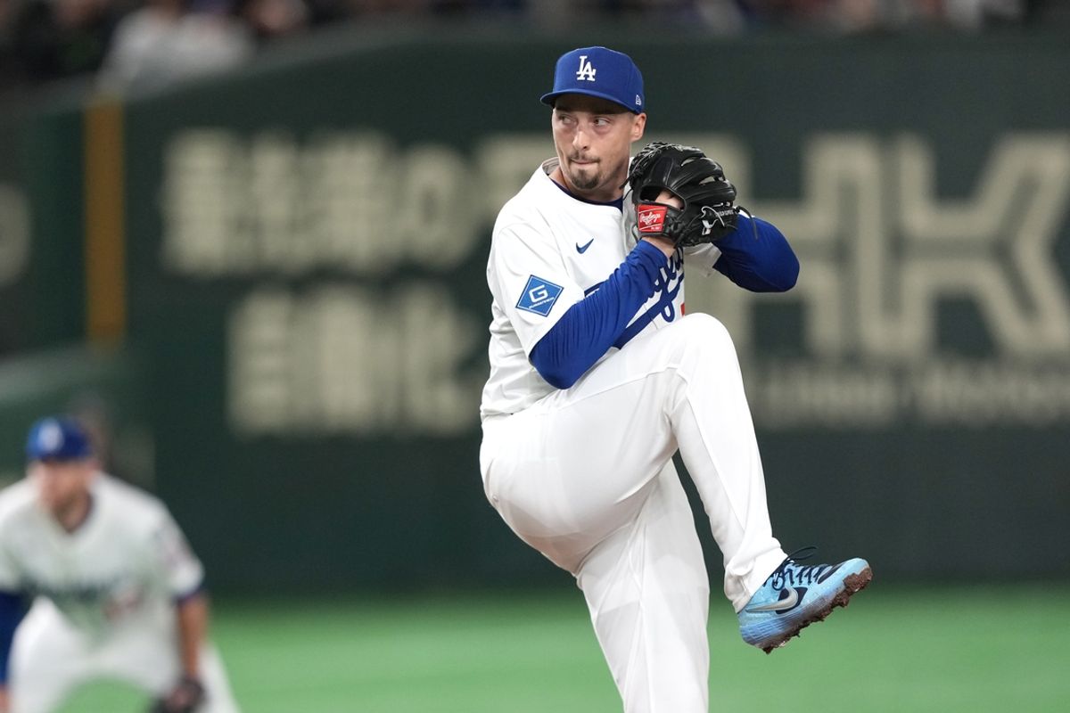 Mar 16, 2025; Bunkyo, Tokyo, Japan; Los Angeles Dodgers starting pitcher Blake Snell (7) throws a pitch against the Hanshin Tigers during the first inning at Tokyo Dome. Mandatory Credit: Darren Yamashita-Imagn Images