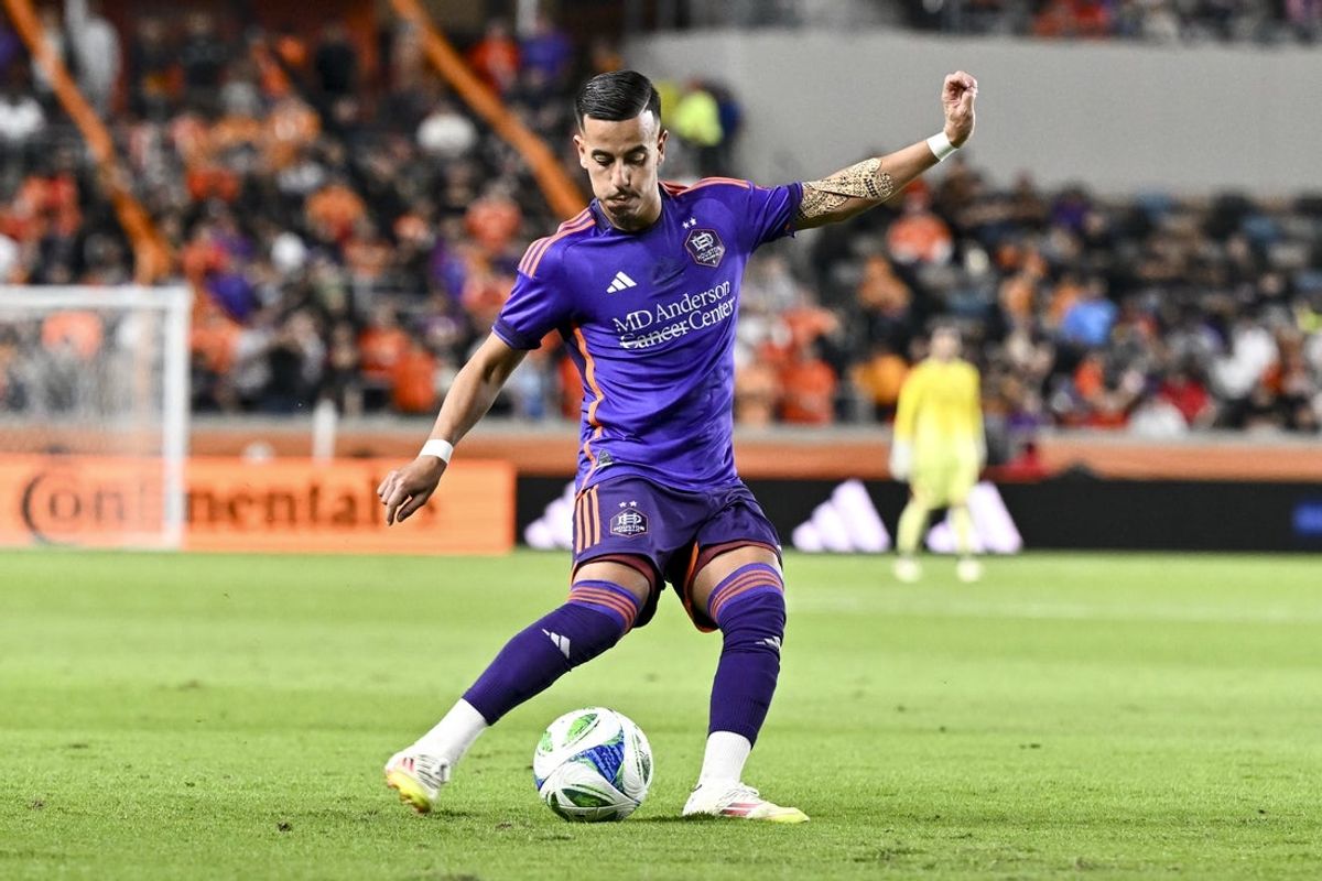 Mar 15, 2025; Houston, Texas, USA; Houston Dynamo midfielder Amine Bassi (8) kicks the ball during the second half against the Real Salt Lake at Shell Energy Stadium. Mandatory Credit: Maria Lysaker-Imagn Images