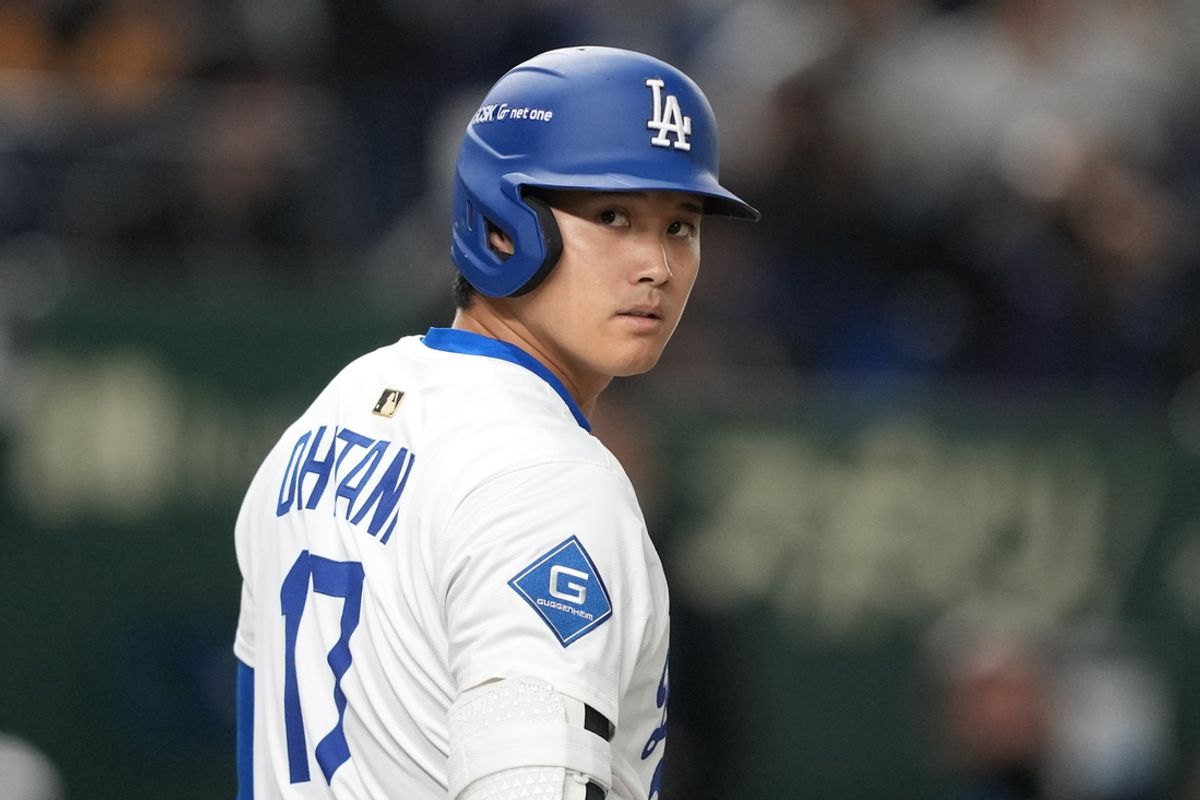 Mar 16, 2025; Bunkyo, Tokyo, Japan; Los Angeles Dodgers designated hitter Shohei Ohtani (17) waits to bat during the first inning against the Hanshin Tigers at Tokyo Dome. Mandatory Credit: Darren Yamashita-Imagn Images