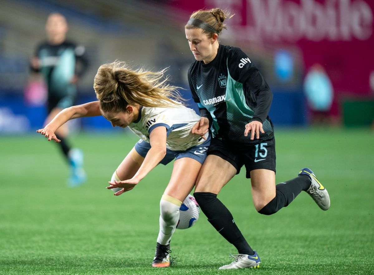 Mar 15, 2025; Seattle, Washington, USA;  Seattle Reign FC forward Jordyn Huitema (9) and Gotham FC defender Tierna Davidson (15) battle for the ball during the second half at Lumen Field. Mandatory Credit: Stephen Brashear-Imagn Images