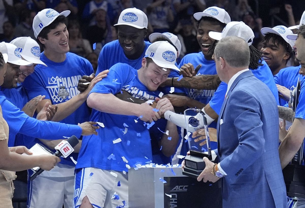 Mar 15, 2025; Charlotte, NC, USA; Duke Blue Devils guard Kon Knueppel (7) celebrates with teammates after winning the 2025 ACC Conference Tournament most valuable player award after the championship game against the Louisville Cardinals at Spectrum Center. Mandatory Credit: Jim Dedmon-Imagn Images