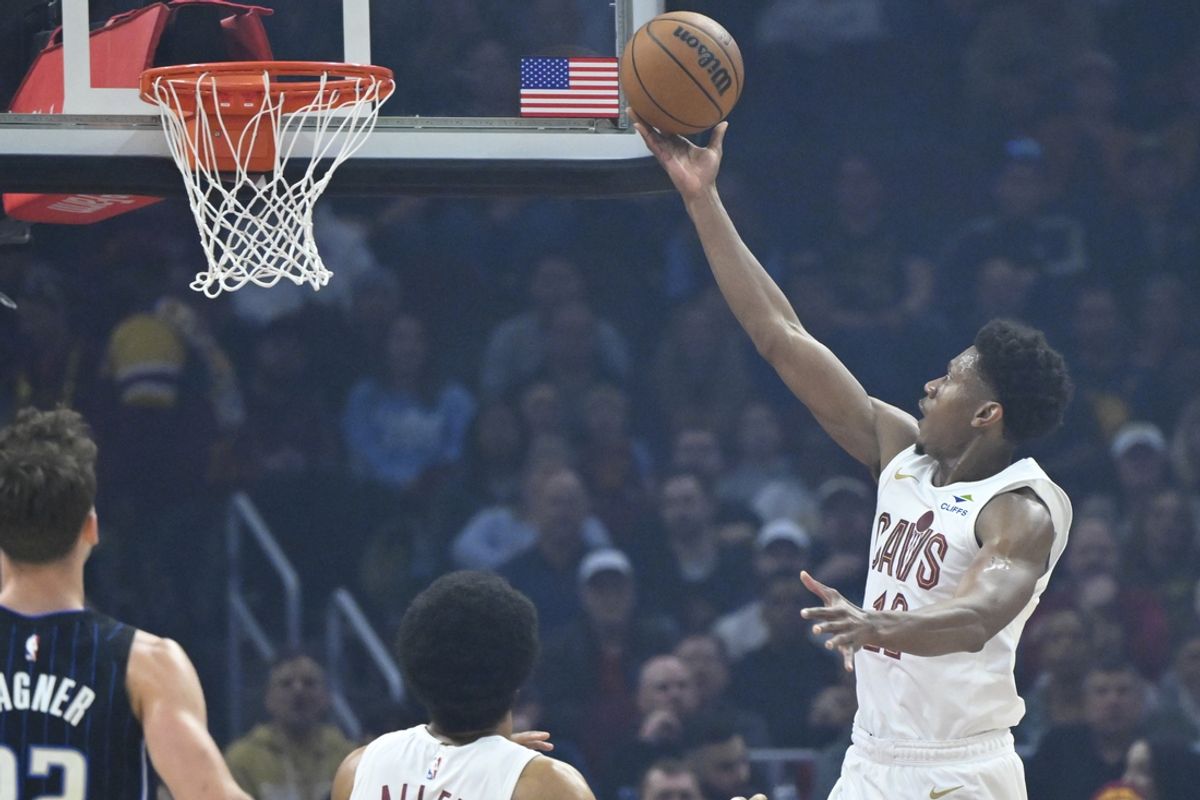 Mar 16, 2025; Cleveland, Ohio, USA; Cleveland Cavaliers forward De'Andre Hunter (12) drives to the basket in the first quarter against the Orlando Magic at Rocket Arena. Mandatory Credit: David Richard-Imagn Images