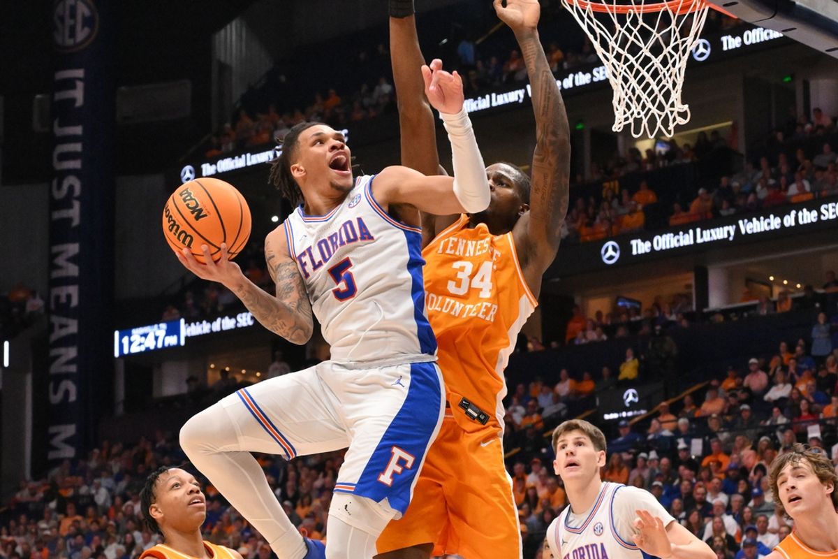 Mar 16, 2025; Nashville, TN, USA; Florida Gators guard Will Richard (5) shoots the ball over Tennessee Volunteers forward Felix Okpara (34) in the first half during the 2025 SEC Championship Game at Bridgestone Arena. Mandatory Credit: Steve Roberts-Imagn Images