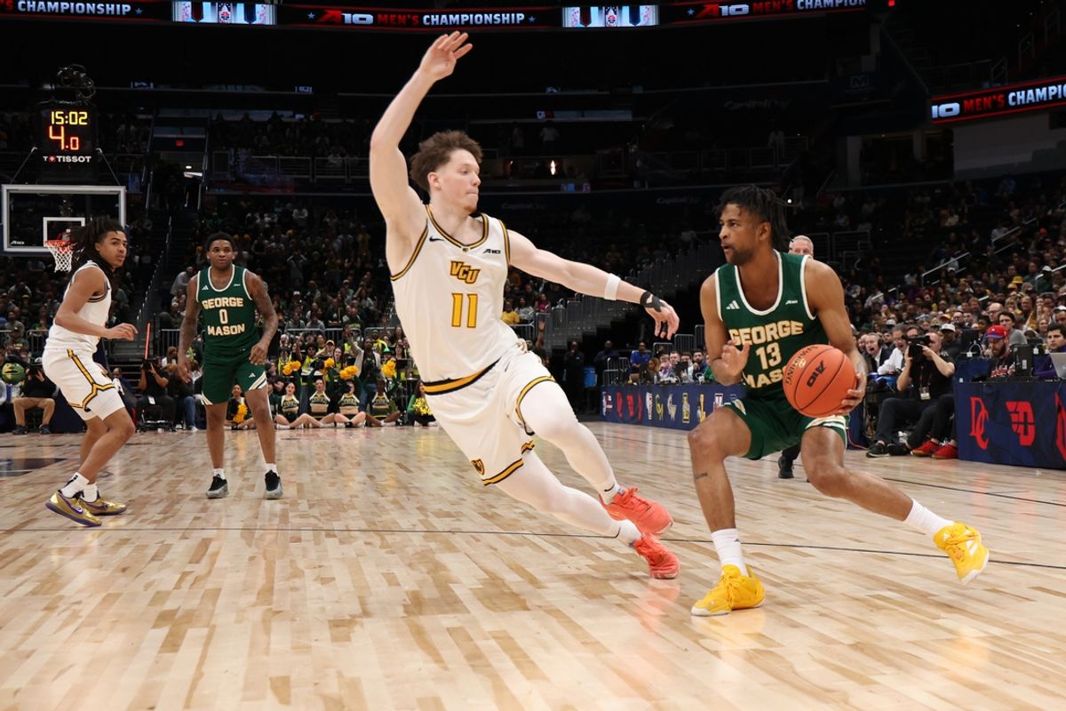 Mar 16, 2025; Washington, D.C., USA; George Mason Patriots guard Darius Maddox (13) drives to the basket as VCU Rams guard Max Shulga (11) defends in the first half at Capital One Arena. Mandatory Credit: Geoff Burke-Imagn Images