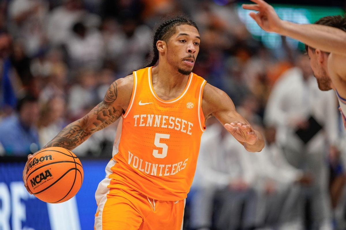 Tennessee guard Zakai Zeigler (5) looks for a path around Florida defenders during the second half of the Southeastern Conference tournament championship at Bridgestone Arena in Nashville, Tenn., Sunday, March 16, 2025.