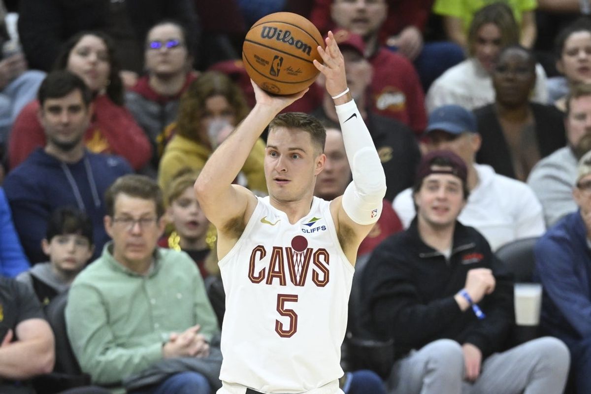 Mar 16, 2025; Cleveland, Ohio, USA; Cleveland Cavaliers guard Sam Merrill (5) shoots in the third quarter against the Orlando Magic at Rocket Arena. Mandatory Credit: David Richard-Imagn Images