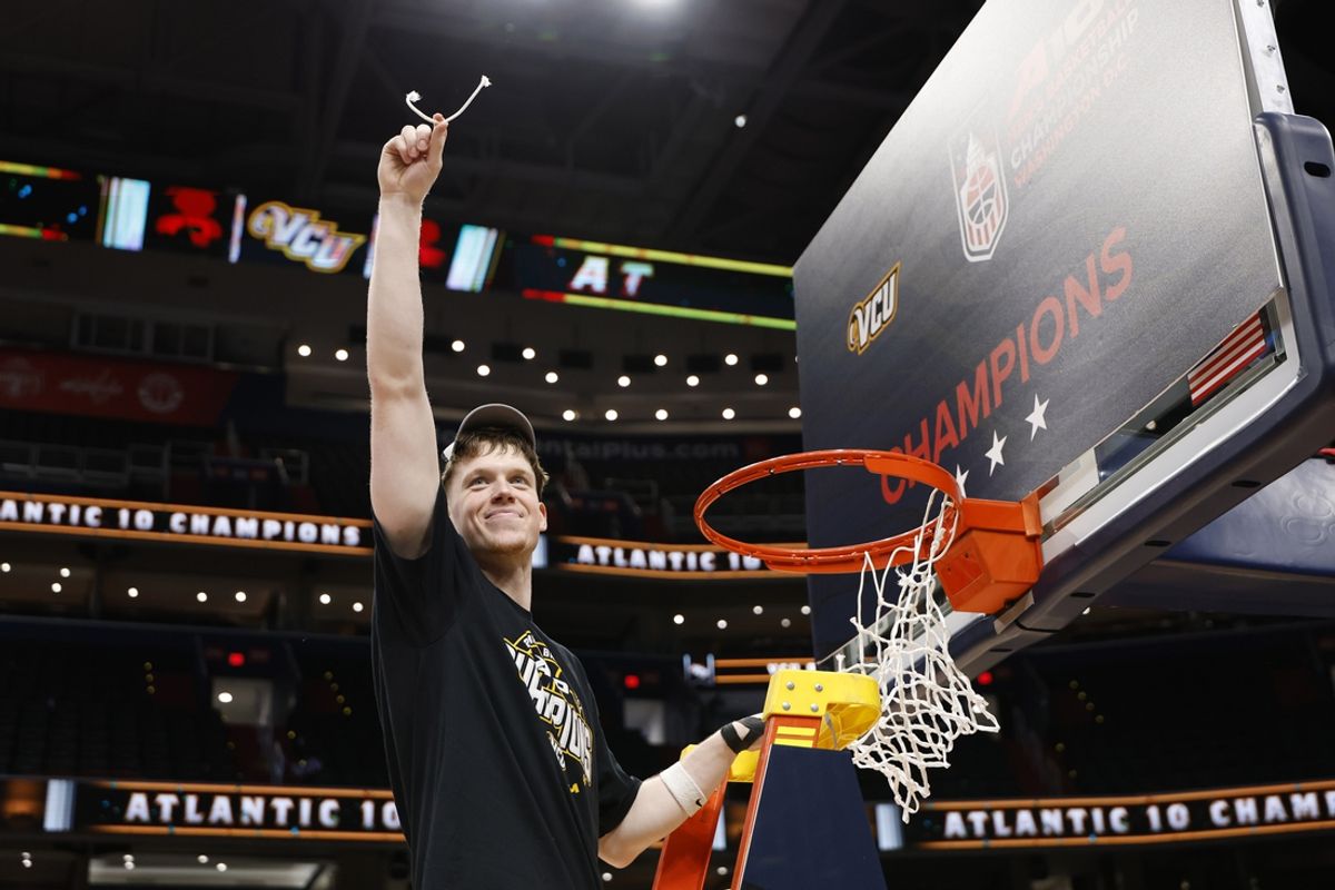 Mar 16, 2025; Washington, D.C., USA; A10 player of the year, VCU Rams guard Max Shulga, holds a piece of the net during the championship trophy ceremony after their game against the George Mason Patriots at Capital One Arena. Mandatory Credit: Geoff Burke-Imagn Images