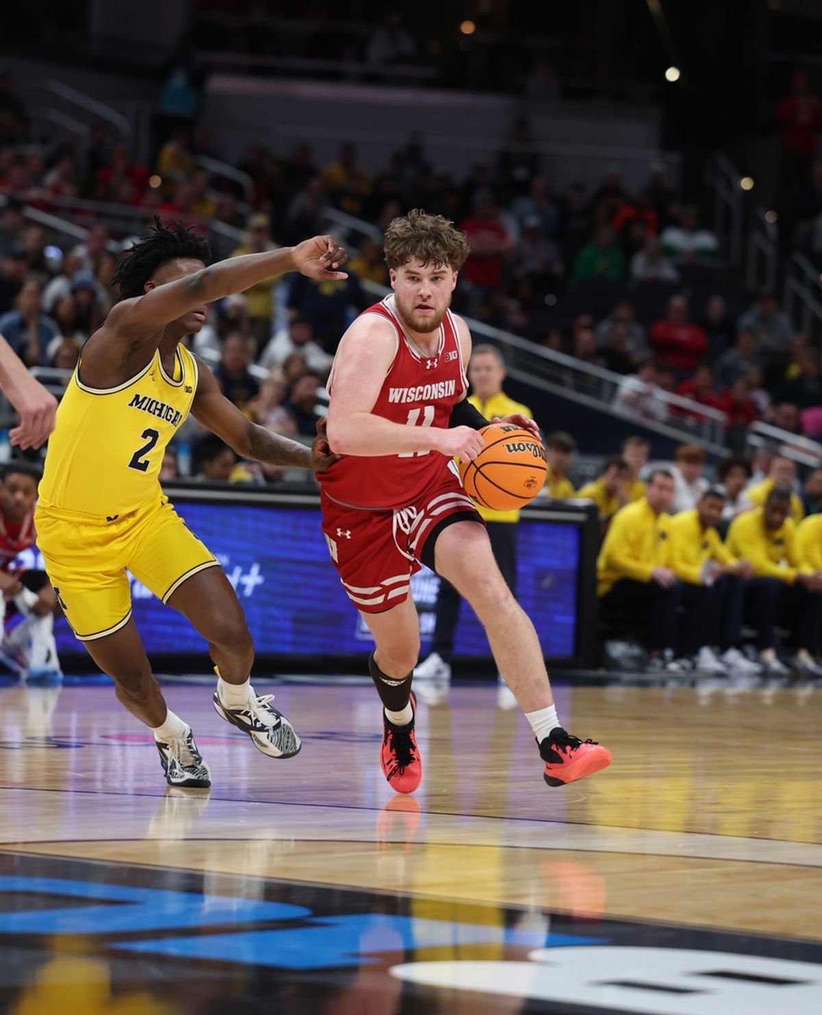 Mar 16, 2025; Indianapolis, IN, USA; Wisconsin Badgers guard Max Klesmit (11) dribbles downcourt past Michigan Wolverines guard L.J. Cason (2) during the second half during the 2025 Big Ten Championship Game at Gainbridge Fieldhouse. Mandatory Credit: Trevor Ruszkowski-Imagn Images
