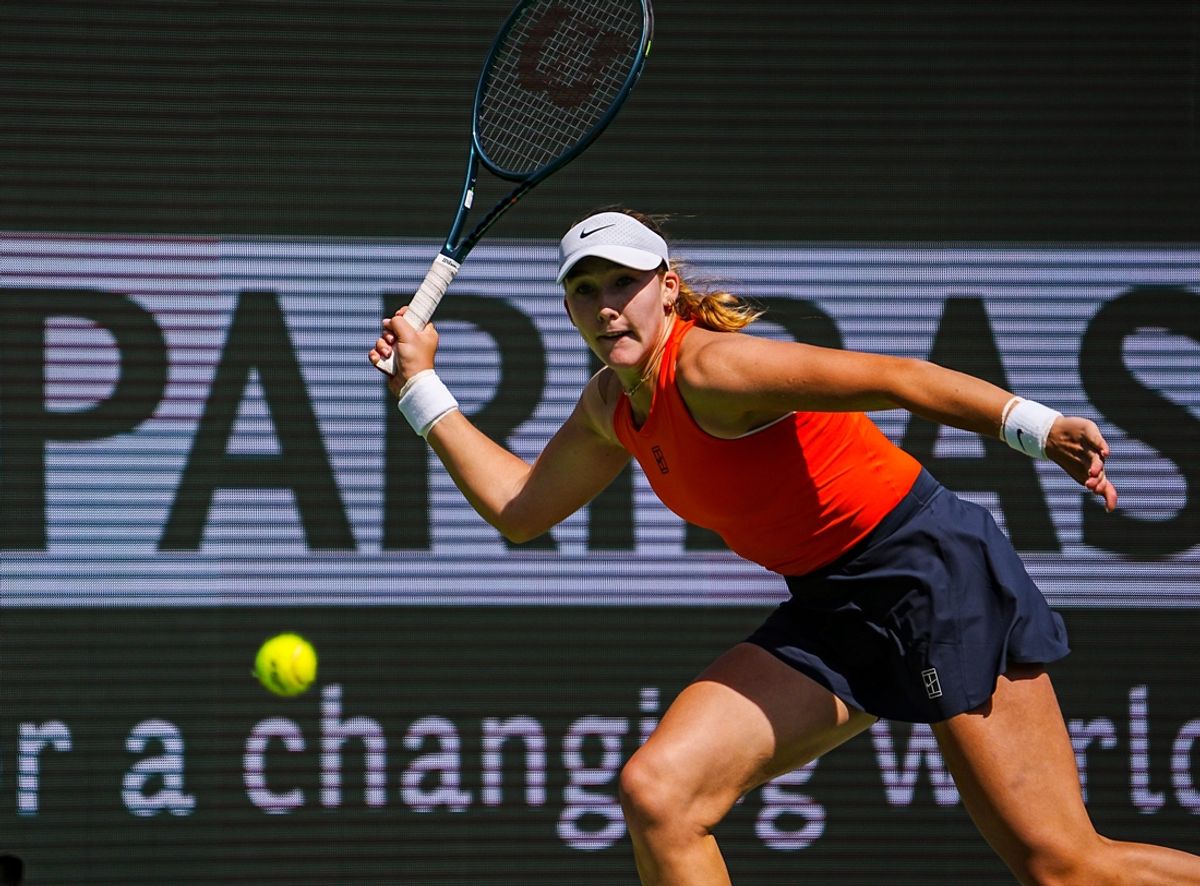 Mirra Andreeva runs wide for a shot to Aryna Sabalenka during the women's championship final of the BNP Paribas Open in Indian Wells, Calif., Sunday, March 16, 2025.