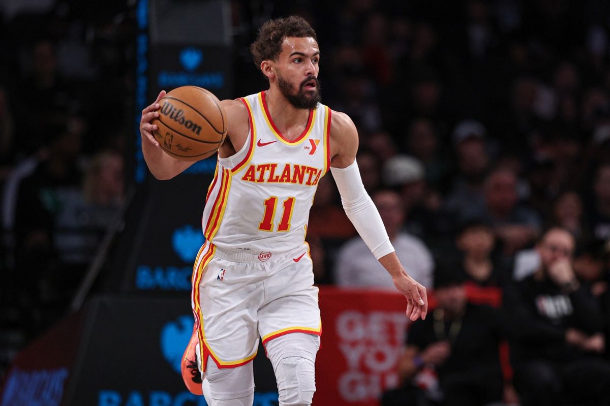 Mar 16, 2025; Brooklyn, New York, USA; Atlanta Hawks guard Trae Young (11) dribbles up court during the first quarter against the Brooklyn Nets at Barclays Center. Mandatory Credit: Vincent Carchietta-Imagn Images