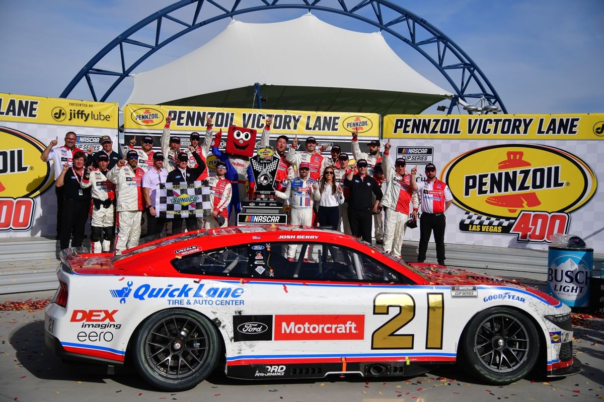 Mar 16, 2025; Las Vegas, Nevada, USA; NASCAR Cup Series driver Josh Berry (21) poses for photos following his victory of the Pennzoil 400 at Las Vegas Motor Speedway. Mandatory Credit: Gary A. Vasquez-Imagn Images