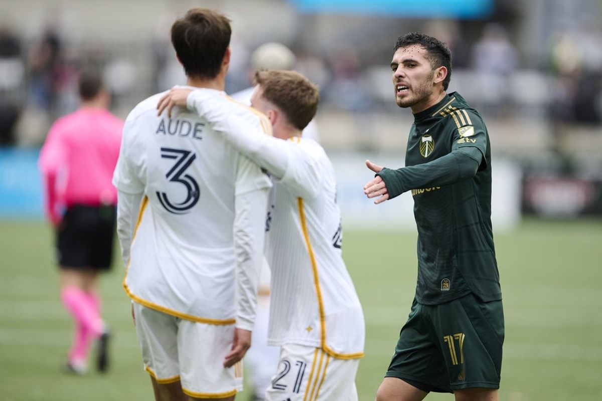 Mar 16, 2025; Portland, Oregon, USA; Portland Timbers midfielder Cristhian Paredes (17) gets into an argument with Los Angeles Galaxy defender Julian Aude (3) after a game at Providence Park. Mandatory Credit: Troy Wayrynen-Imagn Images