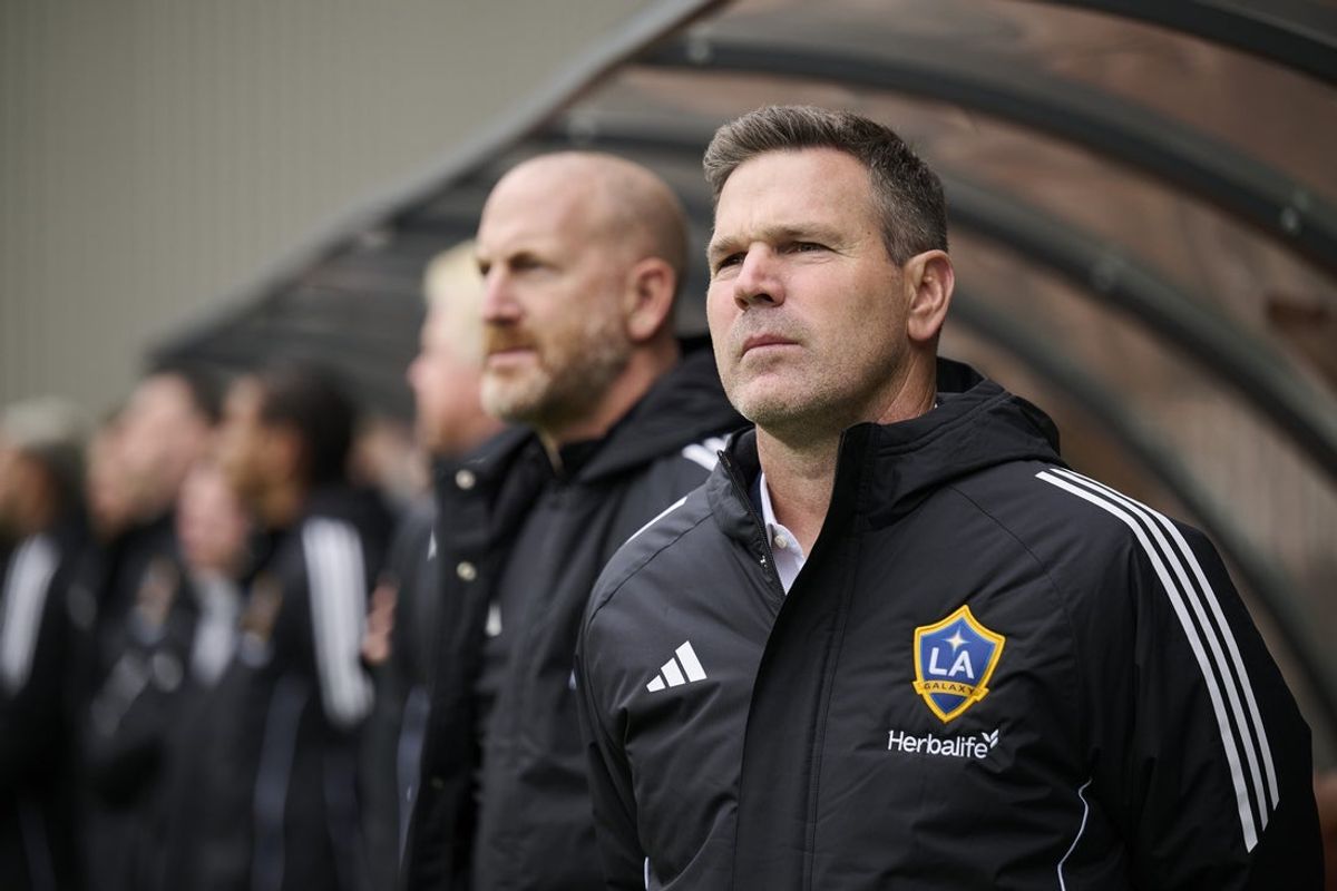 Mar 16, 2025; Portland, Oregon, USA; Los Angeles Galaxy head coach Greg Vanney stands during the singing of the national anthem before a game against the Portland Timbers at Providence Park. Mandatory Credit: Troy Wayrynen-Imagn Images