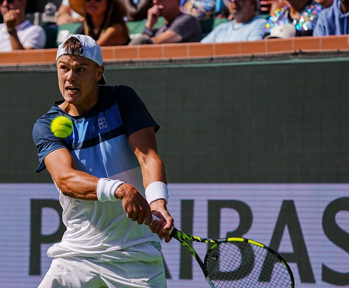 Holger Rune hits to Jack Draper during the men's championship final of the BNP Paribas Open in Indian Wells, Calif., Sunday, March 16, 2025.