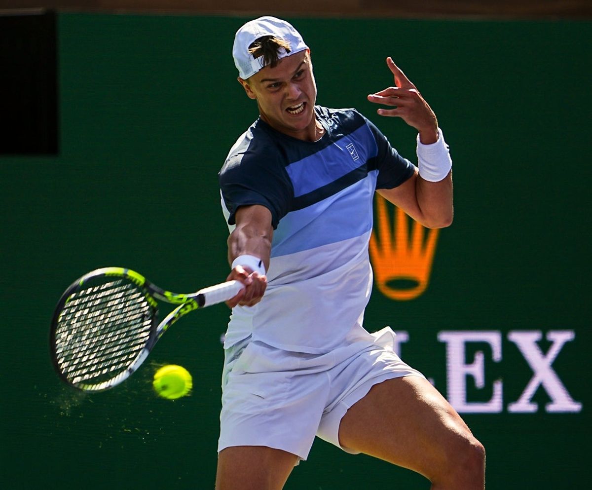 Holger Rune hits to Jack Draper during the men's championship final of the BNP Paribas Open in Indian Wells, Calif., Sunday, March 16, 2025.