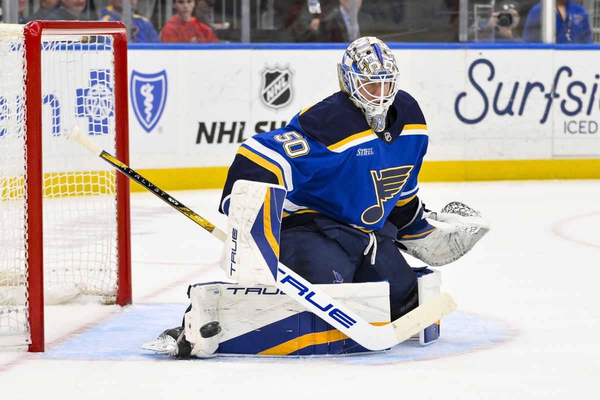 Mar 16, 2025; St. Louis, Missouri, USA;  St. Louis Blues goaltender Jordan Binnington (50) defends the net against the Anaheim Ducks during the first period at Enterprise Center. Mandatory Credit: Jeff Curry-Imagn Images