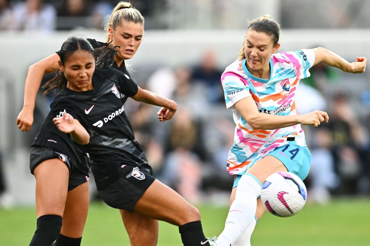 Mar 16, 2025; Los Angeles, California, USA; Angel City FC forward Alyssa Thompson (21) blocks a shot by San Diego Wave FC defender Kristen McNabb (14) during the second half at BMO Stadium. Mandatory Credit: Kelvin Kuo-Imagn Images