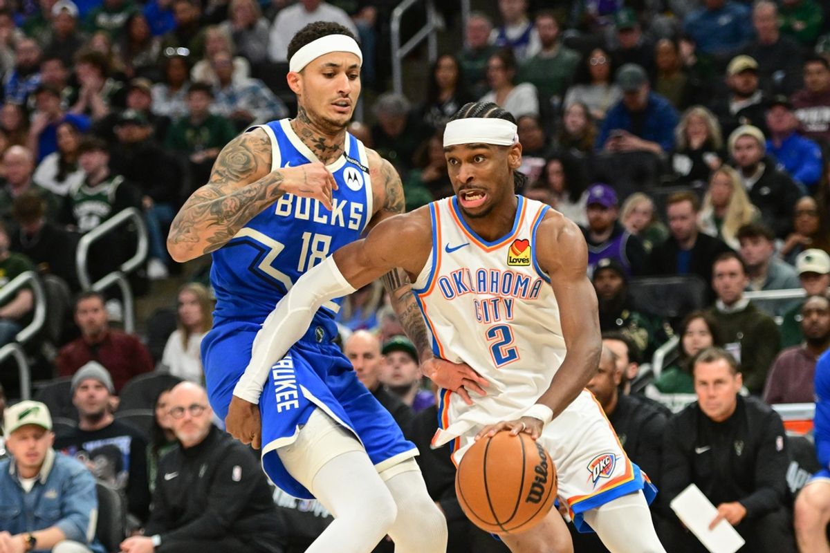 Mar 16, 2025; Milwaukee, Wisconsin, USA; Oklahoma City Thunder guard Shai Gilgeous-Alexander (2) drives for the basket against Milwaukee Bucks forward Kyle Kuzma (18) in the second quarter at Fiserv Forum. Mandatory Credit: Benny Sieu-Imagn Images