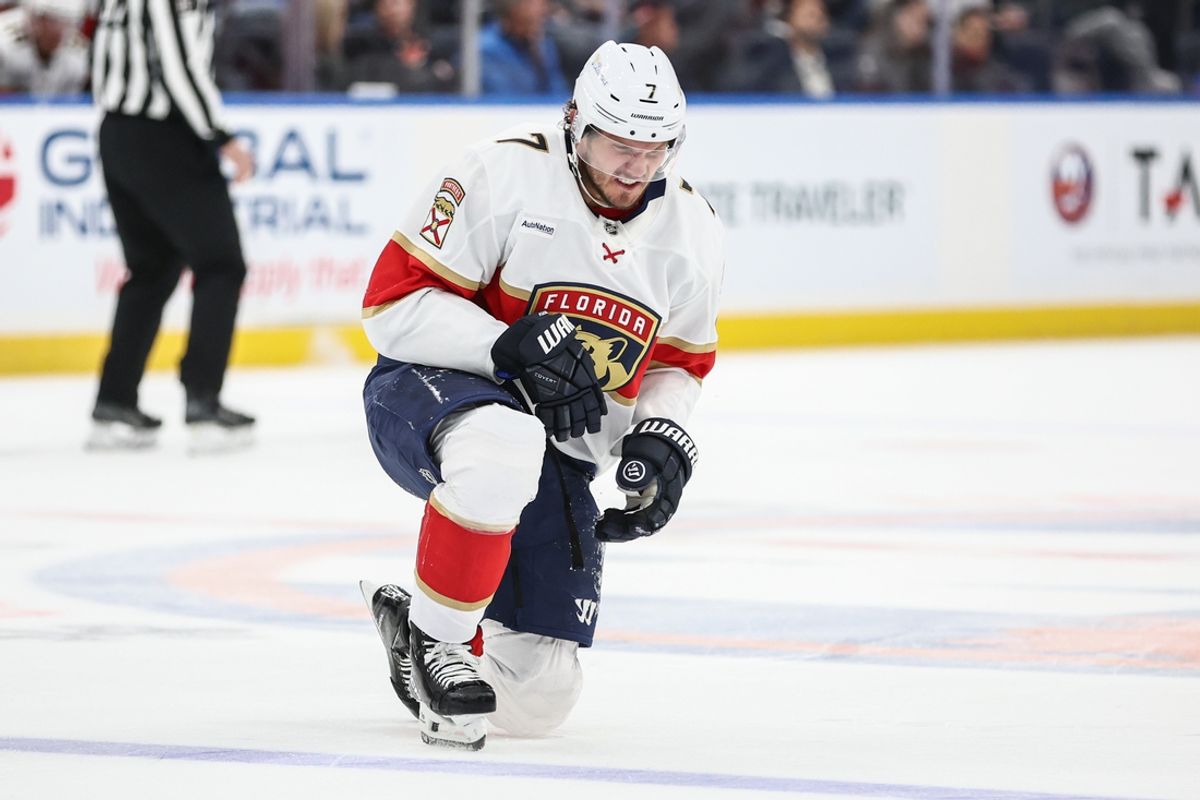Mar 16, 2025; Elmont, New York, USA;  Florida Panthers defenseman Dmitry Kulikov (7) gets up off the ice following a collision in the first period against the New York Islanders at UBS Arena. Mandatory Credit: Wendell Cruz-Imagn Images
