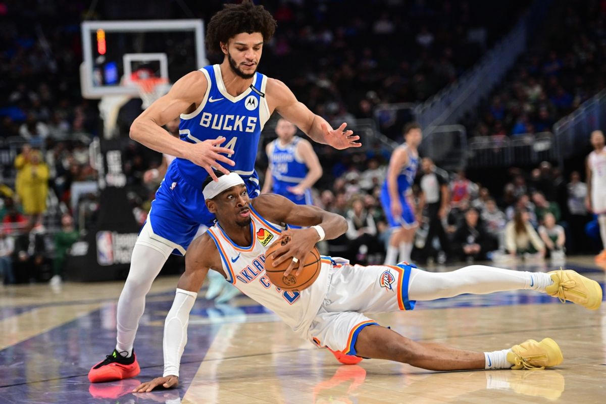 Mar 16, 2025; Milwaukee, Wisconsin, USA;  Oklahoma City Thunder guard Shai Gilgeous-Alexander (2) and Milwaukee Bucks forward Andre Jackson Jr. (44) battle for a loose ball in the fourth quarter at Fiserv Forum. Mandatory Credit: Benny Sieu-Imagn Images
