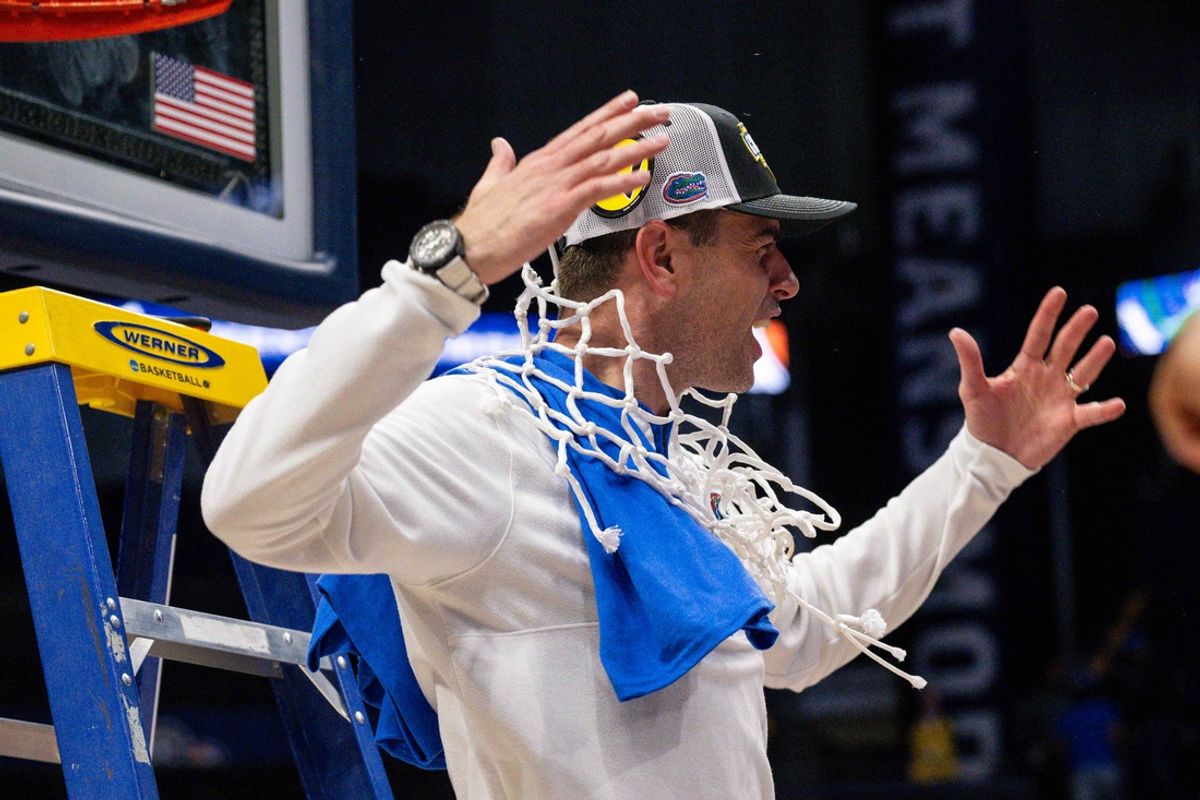 Mar 16, 2025; Nashville, TN, USA;  Florida Gators head coach Todd Golden celebrates the win with cutting down the net against the Tennessee Volunteers at the 2025 SEC Championship Game at Bridgestone Arena. Mandatory Credit: Steve Roberts-Imagn Images
