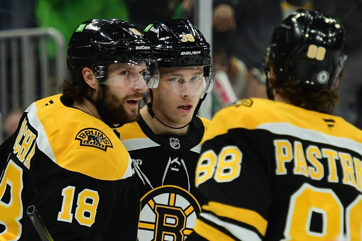 Mar 17, 2025; Boston, Massachusetts, USA; Boston Bruins center Pavel Zacha (18) congratulates center Morgan Geekie (39) after scoring a goal during the first period against the Buffalo Sabres at TD Garden. Mandatory Credit: Bob DeChiara-Imagn Images