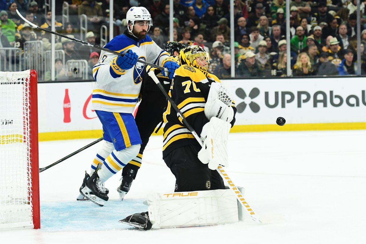 Mar 17, 2025; Boston, Massachusetts, USA;  Boston Bruins goaltender Joonas Korpisalo (70) makes a save in front of Buffalo Sabres right wing Alex Tuch (89) during the second period at TD Garden. Mandatory Credit: Bob DeChiara-Imagn Images