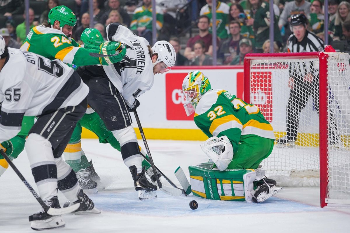 Mar 17, 2025; Saint Paul, Minnesota, USA;  Los Angeles Kings right wing Alex Laferriere (14) shoots against the Minnesota Wild goaltender Filip Gustavsson (32) in the first period at Xcel Energy Center. Mandatory Credit: Brad Rempel-Imagn Images