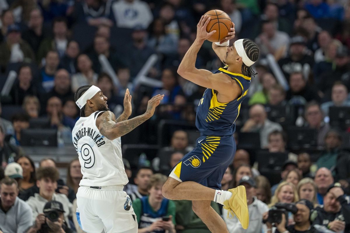 Mar 17, 2025; Minneapolis, Minnesota, USA; Indiana Pacers guard Andrew Nembhard (2) shoots the ball over Minnesota Timberwolves guard Nickeil Alexander-Walker (9) in the first half at Target Center. Mandatory Credit: Jesse Johnson-Imagn Images