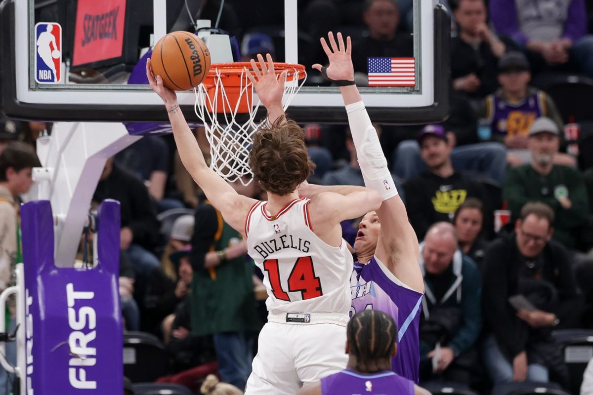 Mar 17, 2025; Salt Lake City, Utah, USA;  Chicago Bulls forward Matas Buzelis (14) gets past Utah Jazz center Walker Kessler (24) and to the basket during the first quarter at Delta Center. Mandatory Credit: Chris Nicoll-Imagn Images