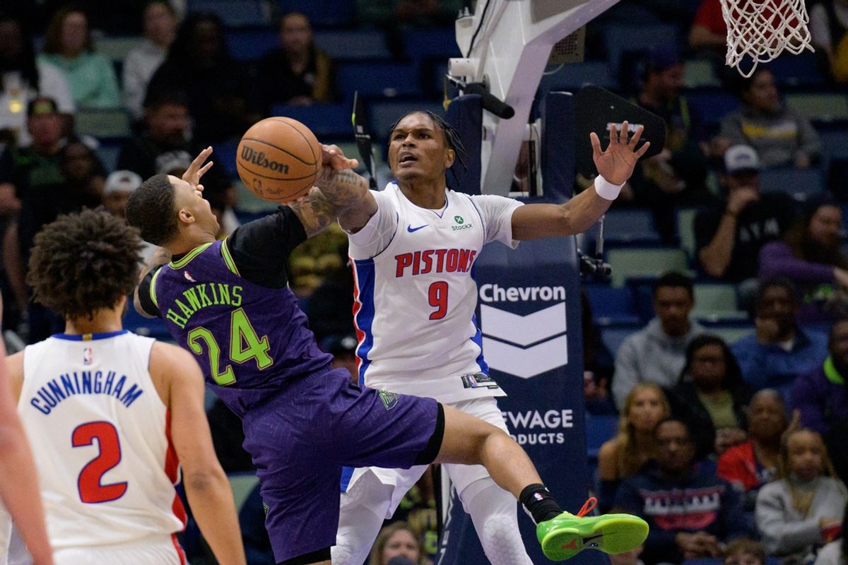 Mar 17, 2025; New Orleans, Louisiana, USA; Detroit Pistons forward Ausar Thompson (9) blocks a shot by New Orleans Pelicans guard Jordan Hawkins (24) during the first half at Smoothie King Center. Mandatory Credit: Matthew Hinton-Imagn Images