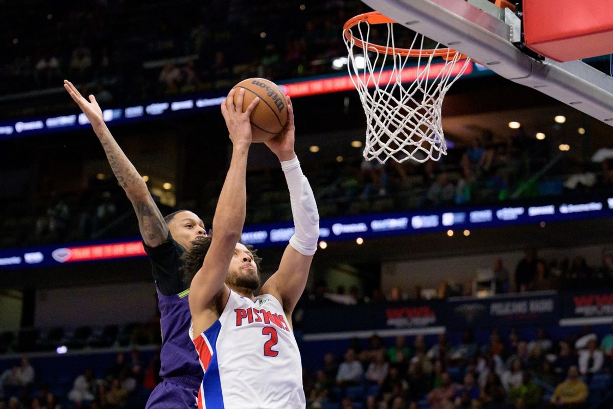 Mar 17, 2025; New Orleans, Louisiana, USA;  Detroit Pistons guard Cade Cunningham (2) dunks against New Orleans Pelicans guard Jordan Hawkins (24) during the first half at Smoothie King Center. Mandatory Credit: Matthew Hinton-Imagn Images
